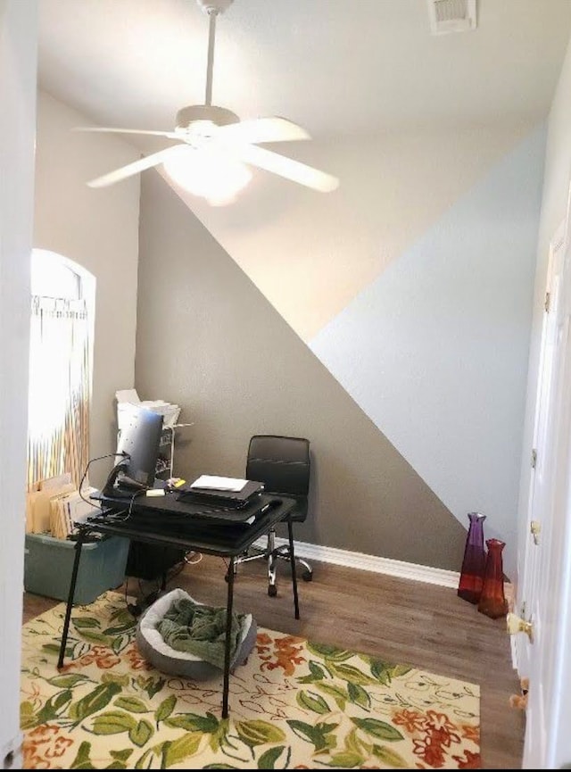 office featuring hardwood / wood-style floors and ceiling fan