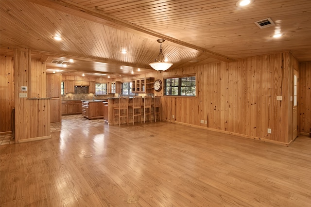 bar featuring wooden ceiling, pendant lighting, and light hardwood / wood-style floors