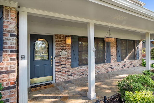 doorway to property featuring a porch