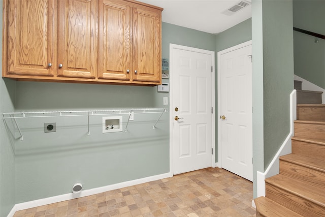 laundry area featuring hookup for an electric dryer, cabinets, and washer hookup