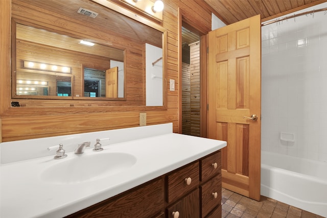 bathroom featuring wooden walls, shower / tub combo with curtain, vanity, and wooden ceiling