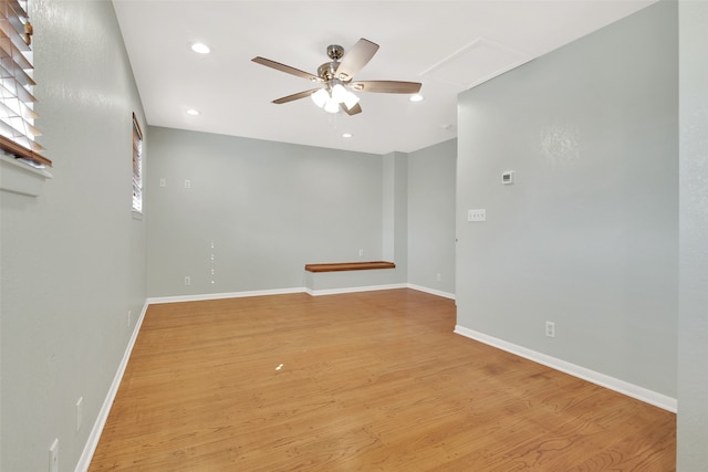 empty room featuring ceiling fan and light wood-type flooring