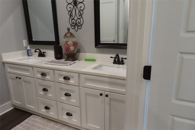 bathroom featuring hardwood / wood-style floors and vanity