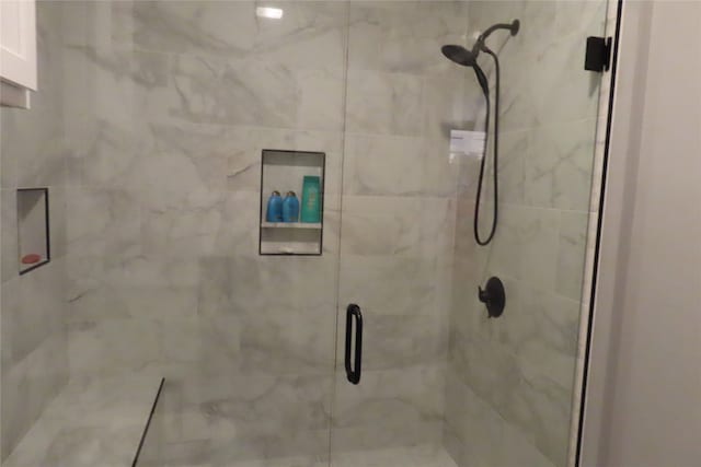 bathroom featuring an enclosed shower