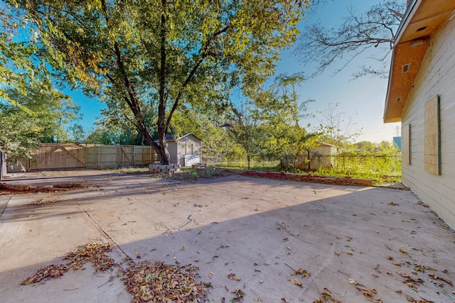 view of patio featuring a storage shed