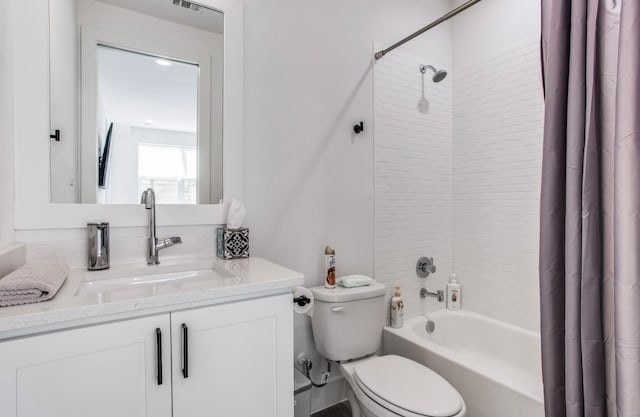 full bathroom with vanity, shower / bath combination with curtain, and toilet