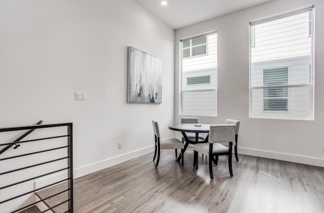 dining area featuring wood-type flooring