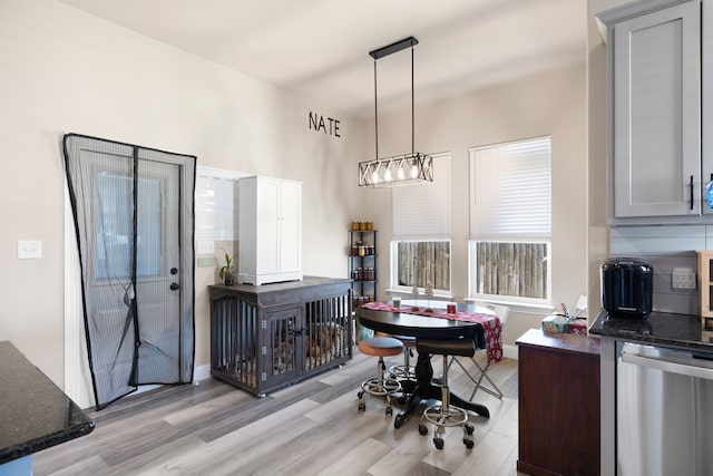 dining space with light wood-type flooring