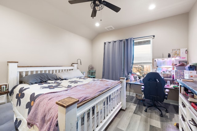 bedroom featuring vaulted ceiling, light hardwood / wood-style flooring, and ceiling fan