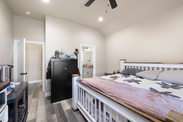 bedroom with ceiling fan, ensuite bathroom, vaulted ceiling, and hardwood / wood-style flooring