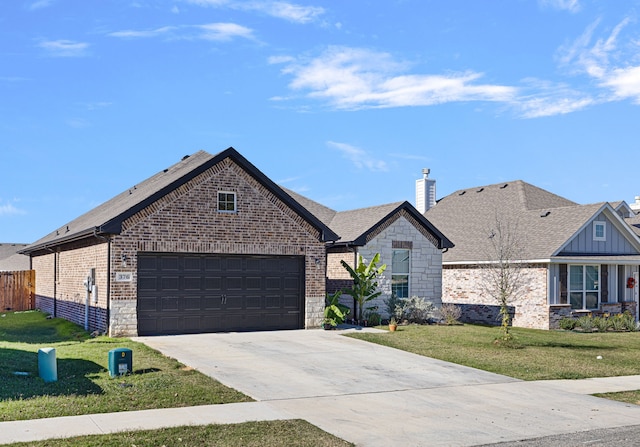 view of front of house with a front lawn and a garage