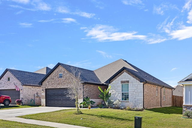 view of front of home featuring a garage and a front yard