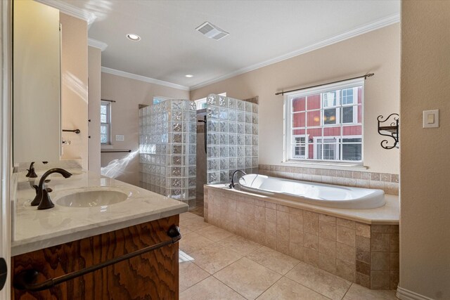 bathroom featuring tile patterned flooring, vanity, a relaxing tiled tub, and ornamental molding