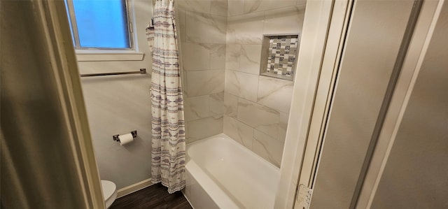 bathroom with toilet, shower / bath combo, and hardwood / wood-style flooring