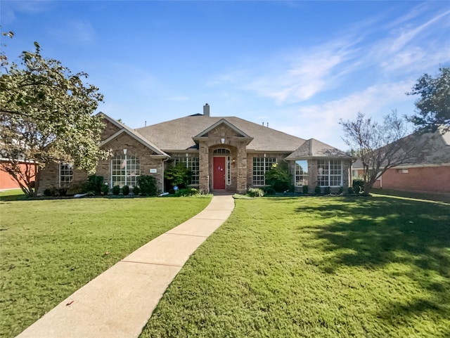 ranch-style home with a front yard