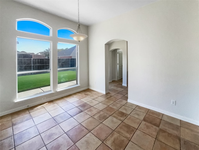 unfurnished dining area with light tile patterned floors