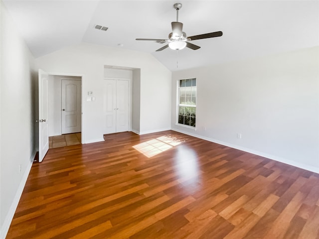 spare room featuring hardwood / wood-style floors, ceiling fan, and vaulted ceiling