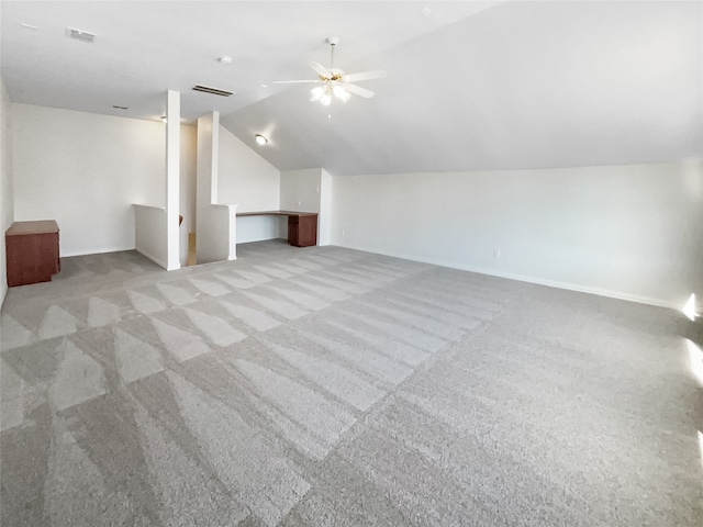 bonus room featuring light carpet, vaulted ceiling, and ceiling fan