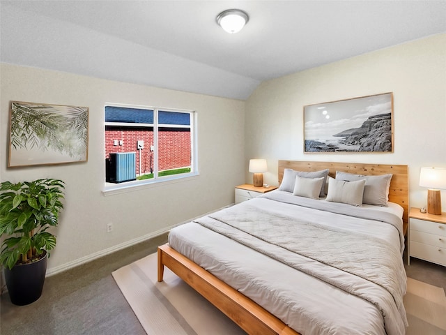 bedroom with carpet and lofted ceiling