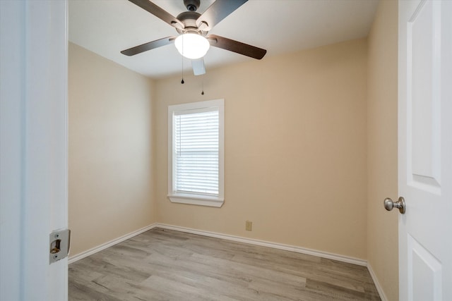 empty room with ceiling fan and light wood-type flooring