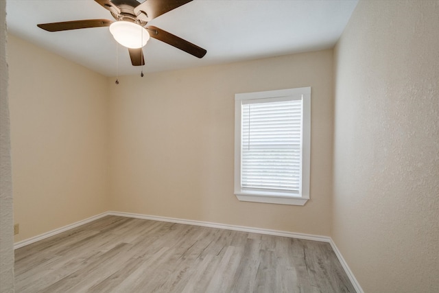 empty room featuring light hardwood / wood-style flooring and ceiling fan