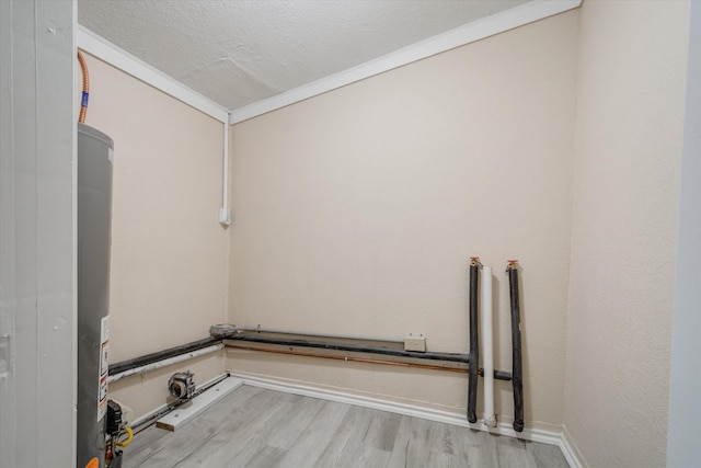 washroom featuring light hardwood / wood-style floors and a textured ceiling