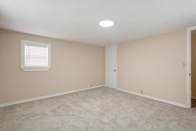 unfurnished room with light carpet