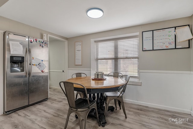 dining area with light hardwood / wood-style flooring