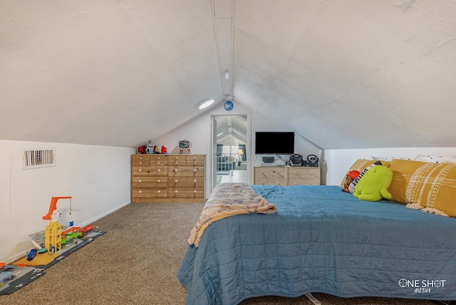 bedroom featuring carpet floors and lofted ceiling