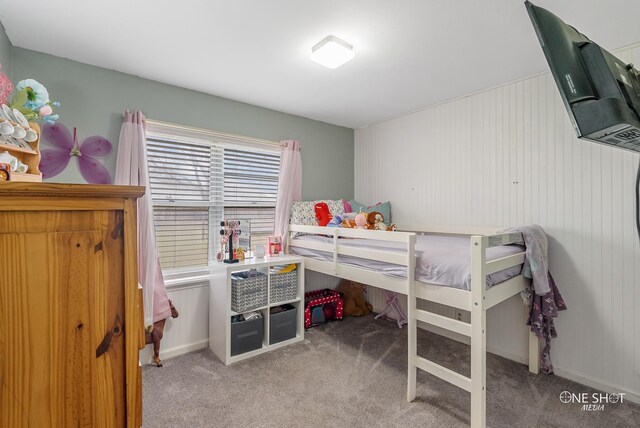 bedroom featuring light carpet