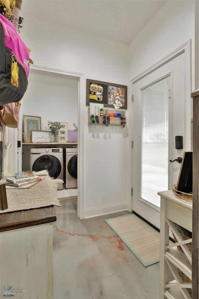 washroom featuring washing machine and dryer