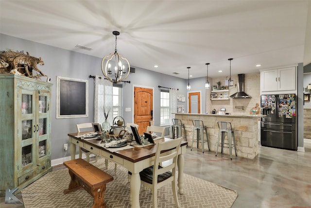 dining area featuring a notable chandelier