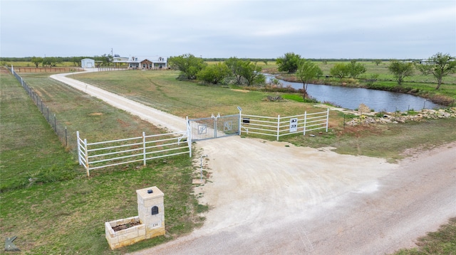 exterior space with a water view and a rural view