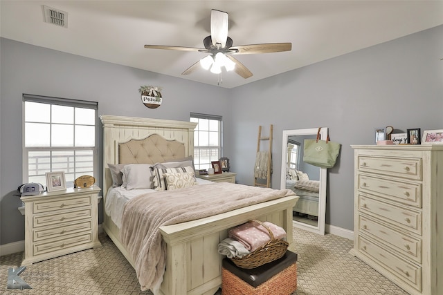 bedroom with light carpet and ceiling fan