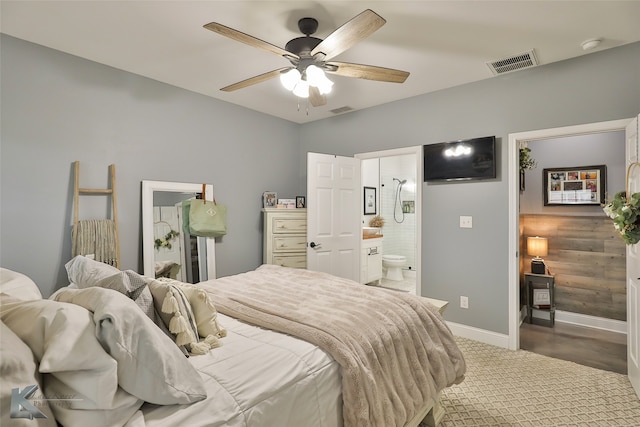 bedroom featuring ensuite bath, ceiling fan, and carpet