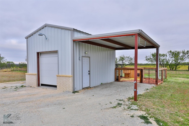 view of outbuilding featuring a garage