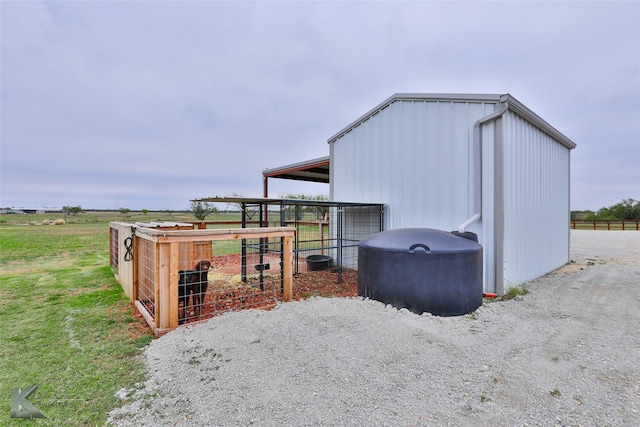 view of outbuilding featuring a rural view