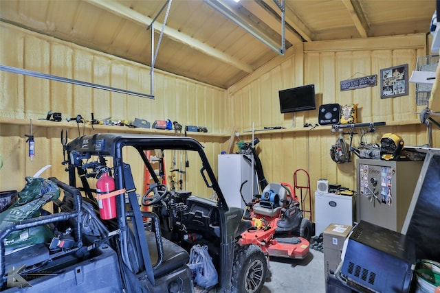 garage featuring wood walls