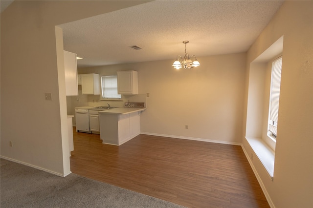 7208 Ridge Rd W, Fort Worth, TX 76133 - kitchen with plenty of natural light, white cabinetry, a chandelier, light countertops, and a textured ceiling
