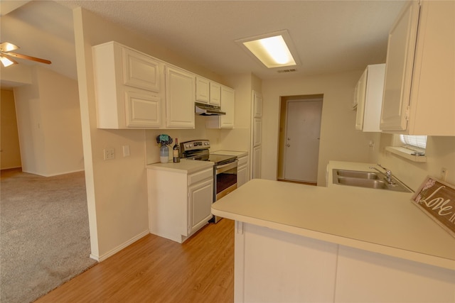 7208 Ridge Rd W, Fort Worth, TX 76133 - kitchen with stainless steel range with electric stovetop, under cabinet range hood, a peninsula, white cabinetry, and light countertops