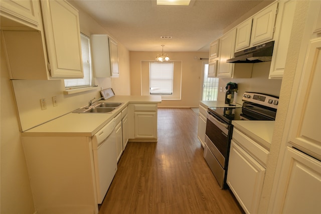 kitchen with sink, pendant lighting, hardwood / wood-style flooring, white cabinets, and stainless steel electric range