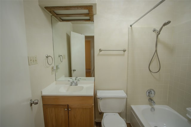 full bathroom featuring vanity, toilet, and tiled shower / bath combo