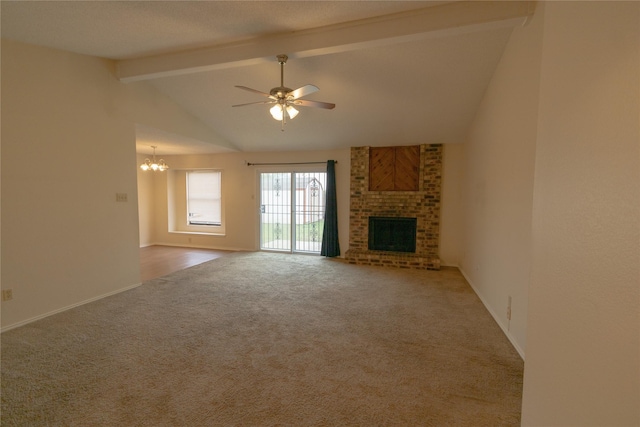 unfurnished living room with lofted ceiling with beams, carpet floors, ceiling fan with notable chandelier, and a brick fireplace