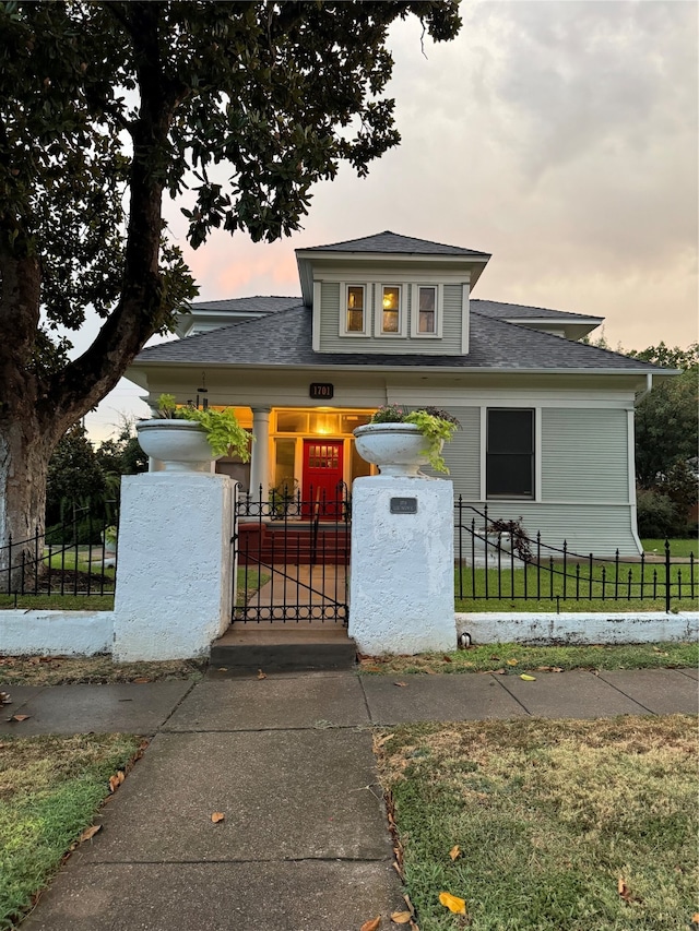 view of front of house with a yard