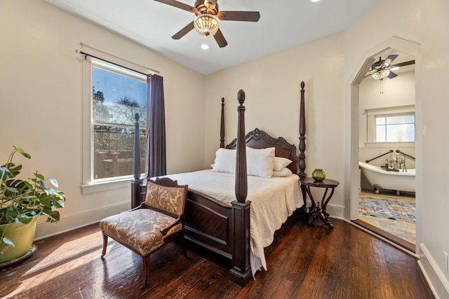 bedroom featuring wood finished floors, a ceiling fan, and baseboards