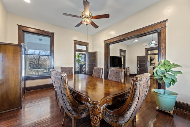 dining area with ceiling fan, baseboards, and wood finished floors