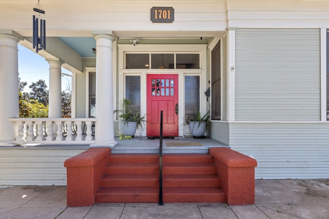 property entrance featuring a porch