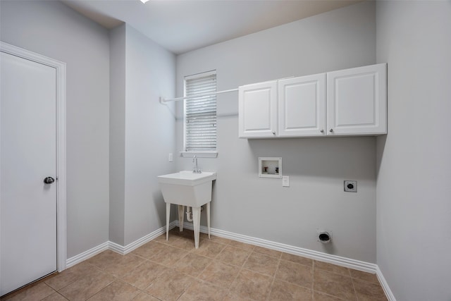 laundry area with cabinets, washer hookup, light tile patterned floors, and electric dryer hookup