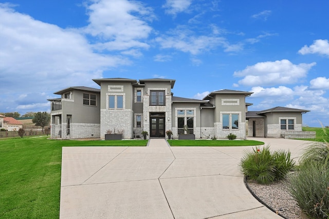 prairie-style house with central air condition unit, french doors, and a front yard