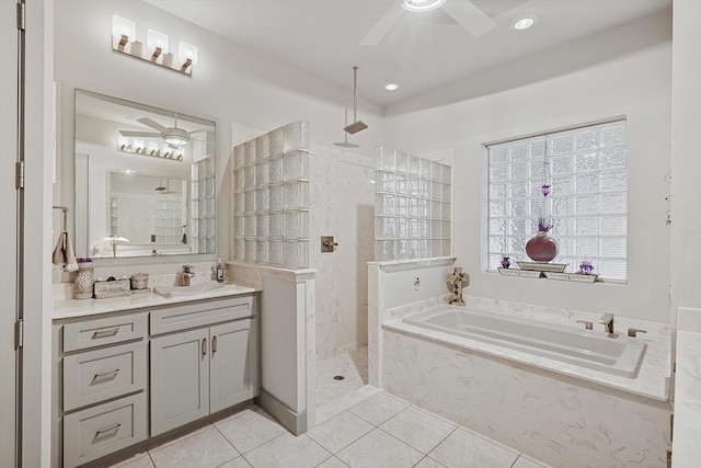 bathroom featuring tile patterned floors, vanity, separate shower and tub, and ceiling fan